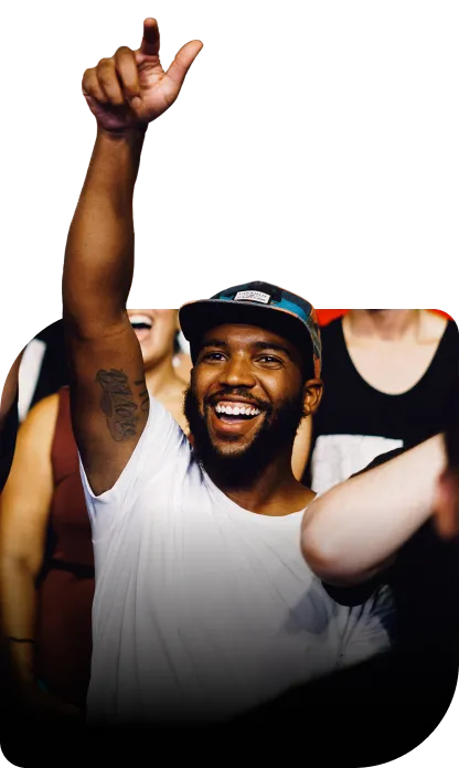 Fans with their hands in the air at a live show